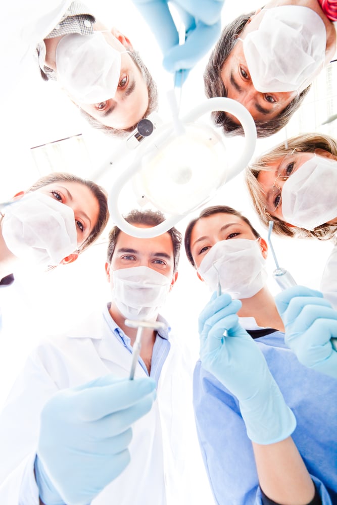 Team of doctors holding medical instruments at the hospital